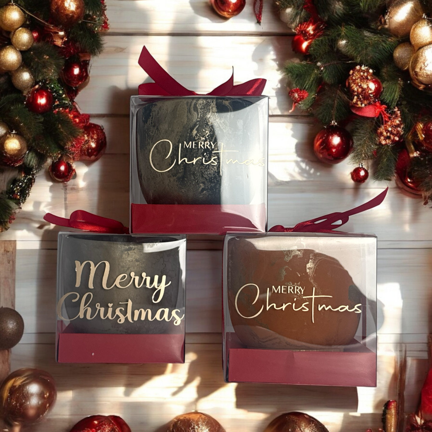 Handcrafted concrete Christmas candle in a clear gift box with red ribbon, luxury holiday soy candle by TAVV Home.Modern minimalist concrete soy candle packaged for Christmas gifting with festive décor around it.Set of luxury handcrafted concrete holiday candles with red bows, Christmas collection by TAVV Home.