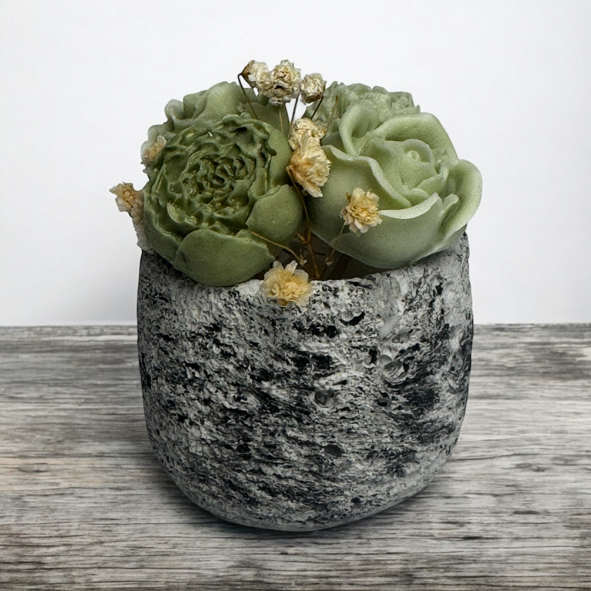 Blooming Candle with sculpted wax peony flowers in a textured concrete vessel, handcrafted minimalist home décor