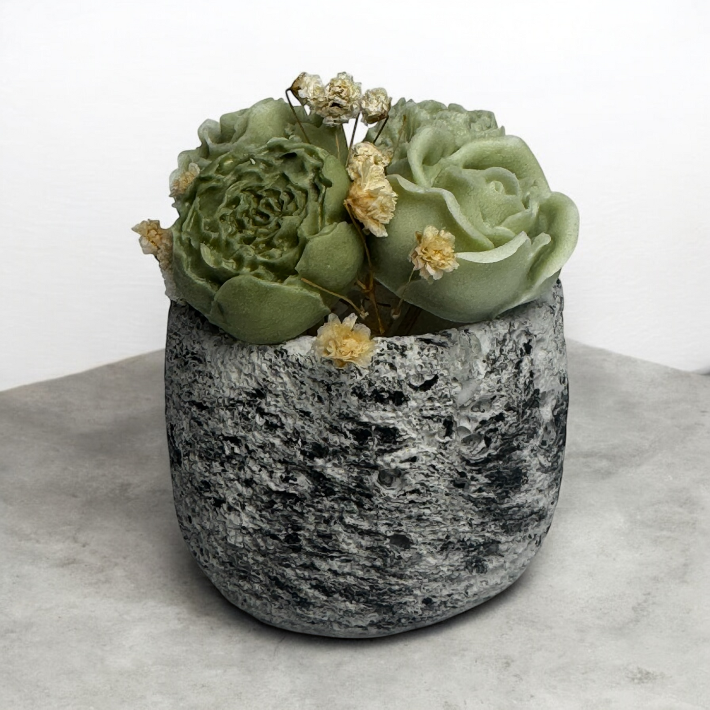 Handmade 3-in-1 floral candle featuring wax melt peonies on top of a modern concrete pot from TAVV Home.